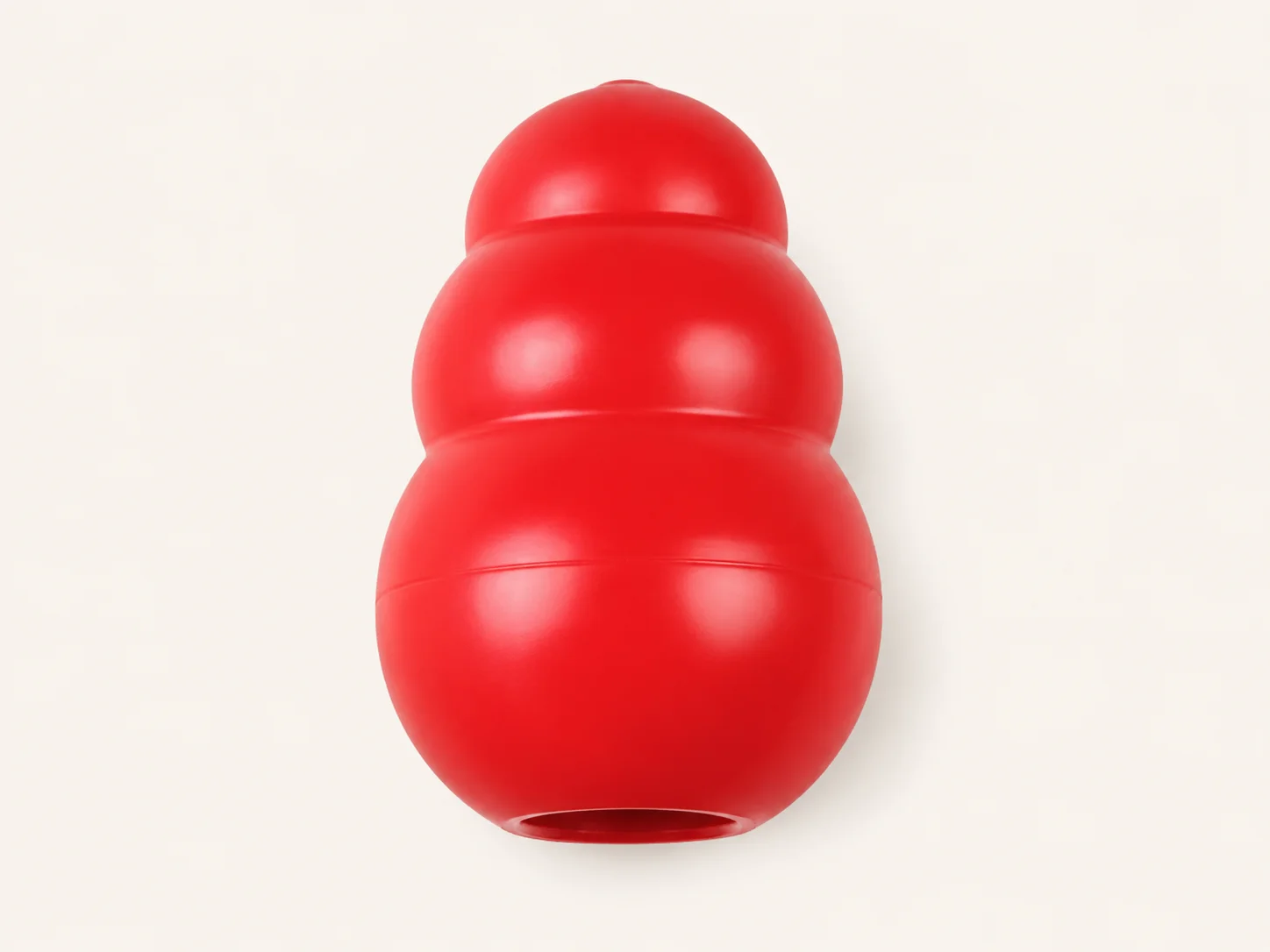 Red KONG Classic rubber food toy shown on a plain background